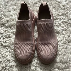 Pink slip on tennis shoes.